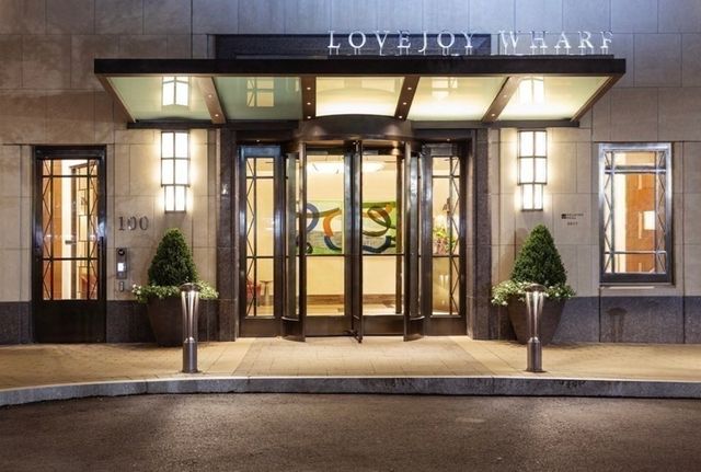 a view of a swimming pool with outdoor seating