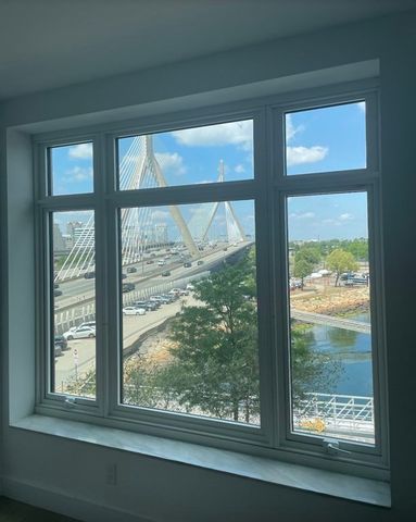 a spacious bathroom with double vanity a a mirror a vanity and a shower