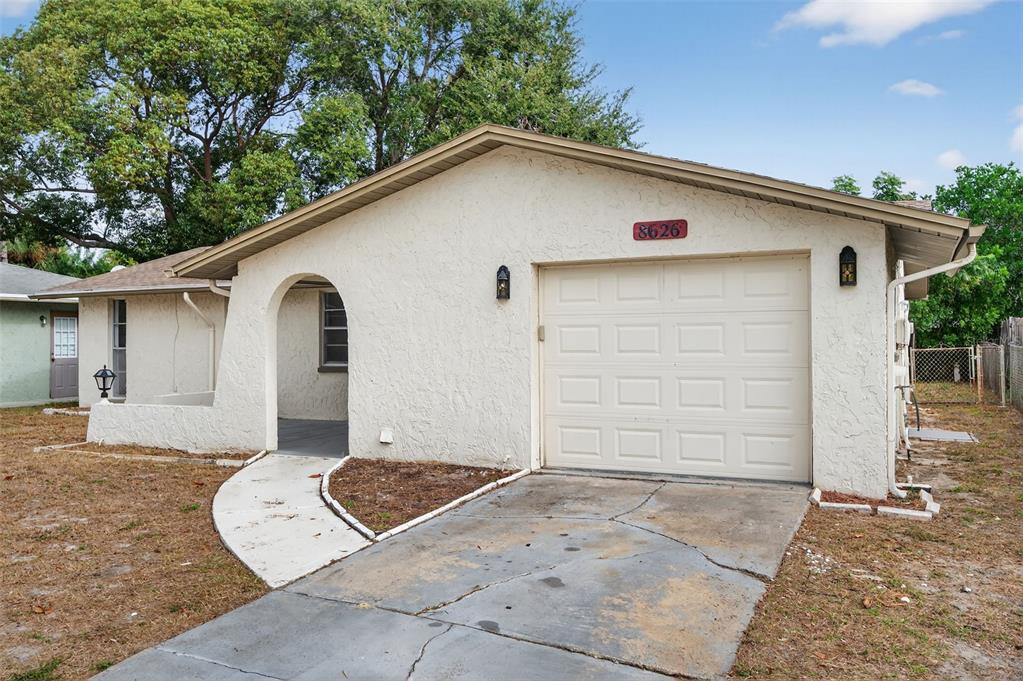 8626 Robilina Road Port Richey, FL 34668 - Photo 2 of 60 a backyard of a house