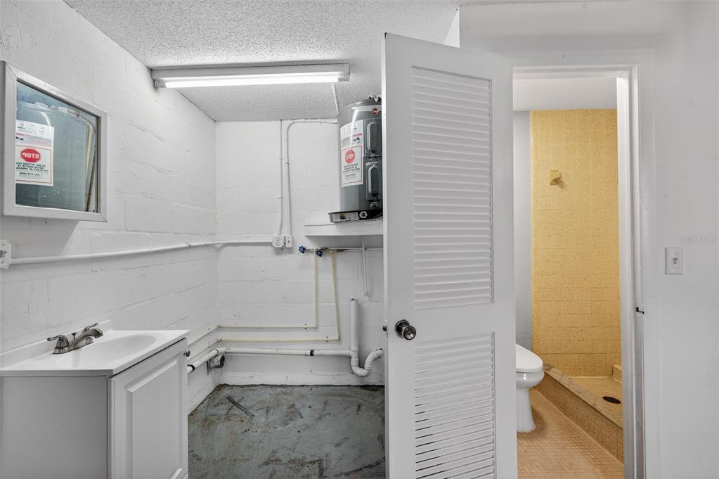 8626 Robilina Road Port Richey, FL 34668 - Photo 30 of 60 a bathroom with a sink and a shower