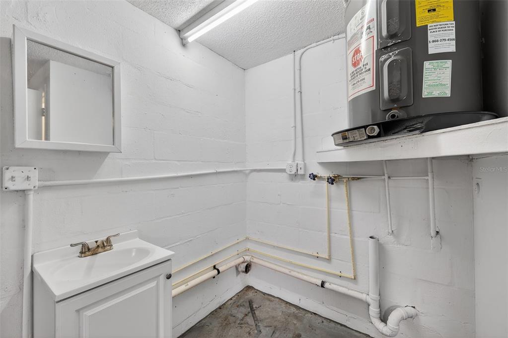 8626 Robilina Road Port Richey, FL 34668 - Photo 31 of 60 a bathroom with a sink vanity and tub