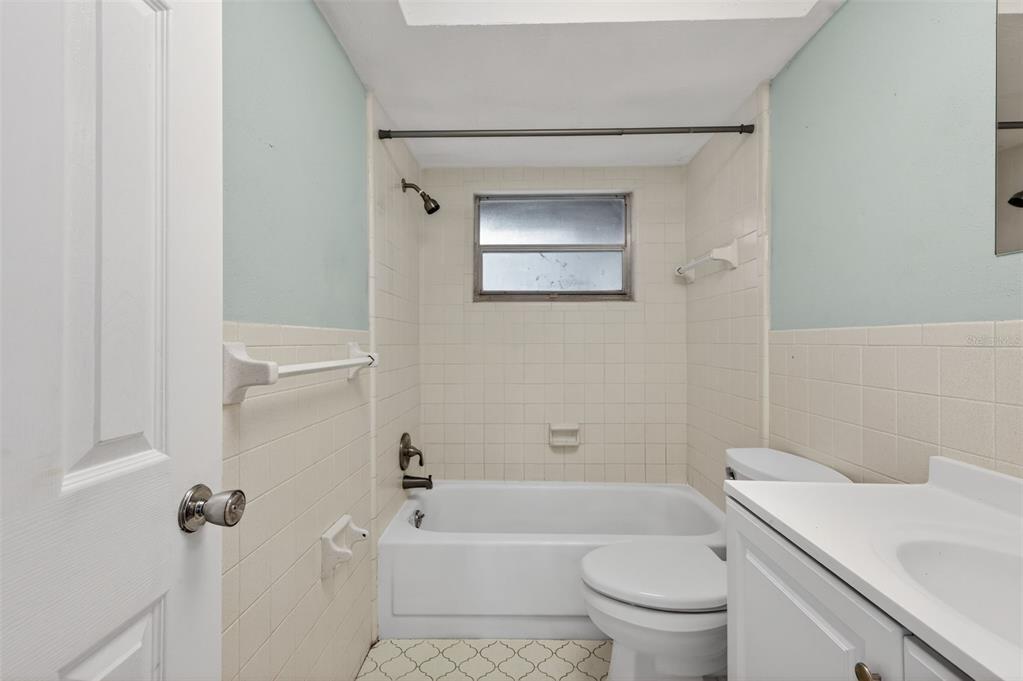8626 Robilina Road Port Richey, FL 34668 - Photo 36 of 60 a bath room with a toilet a sink and a bath tub