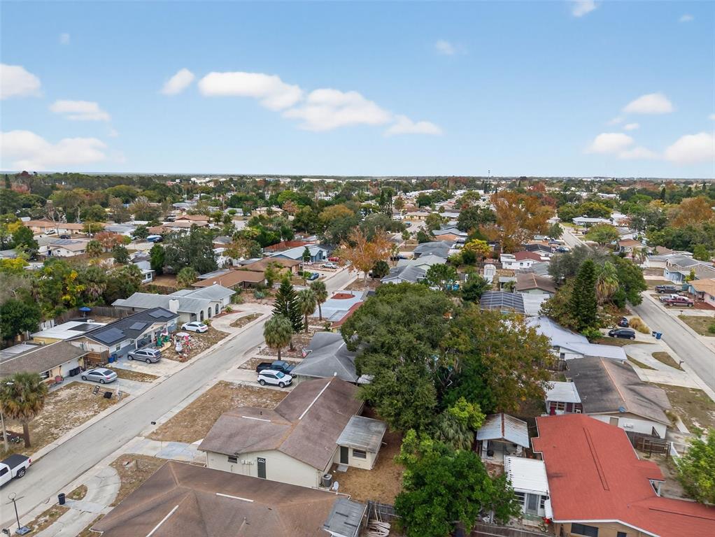 8626 Robilina Road Port Richey, FL 34668 - Photo 55 of 60 an aerial view of residential houses with outdoor space