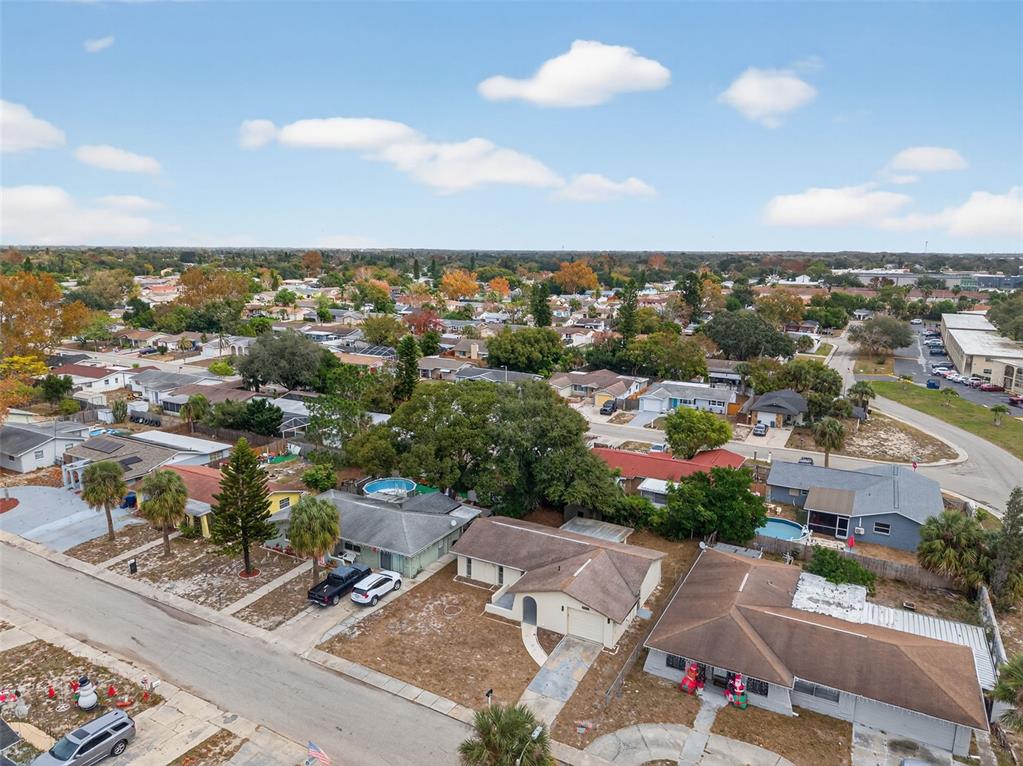 8626 Robilina Road Port Richey, FL 34668 - Photo 56 of 60 an aerial view of residential houses with outdoor space