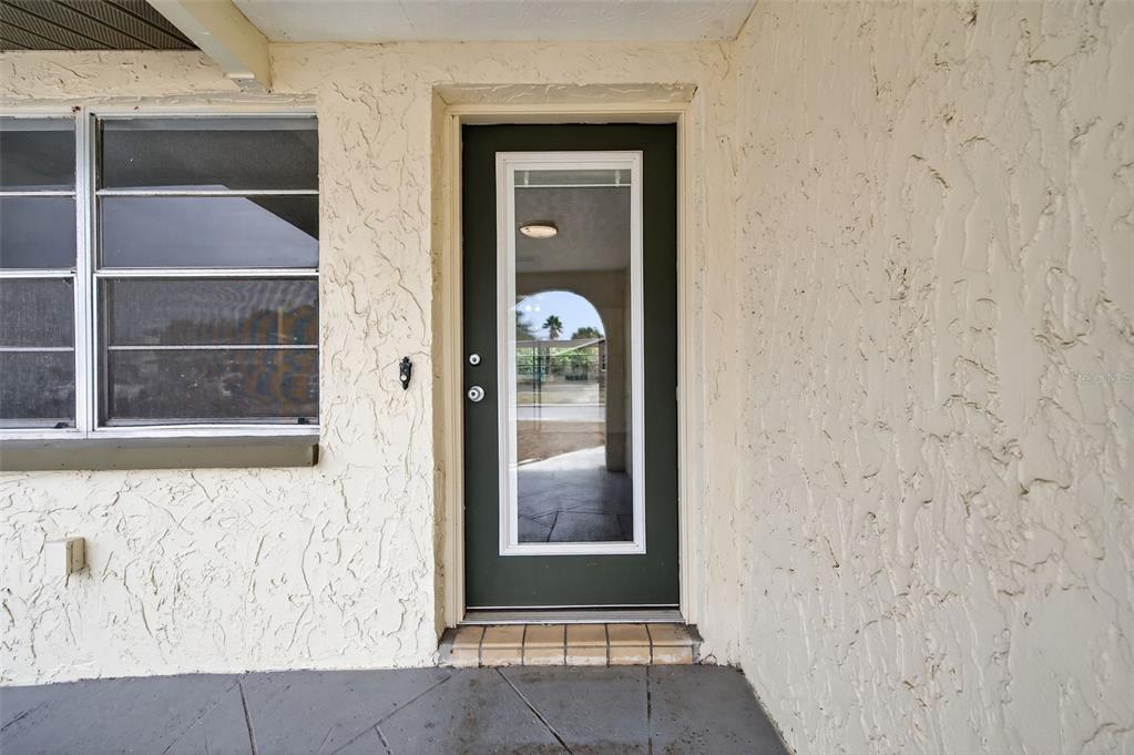 8626 Robilina Road Port Richey, FL 34668 - Photo 7 of 60 a view of a front door of a house