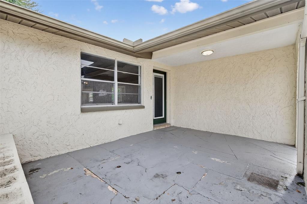 8626 Robilina Road Port Richey, FL 34668 - Photo 9 of 60 a view of empty room with windows