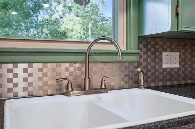 a bathroom with a bathtub and a sink