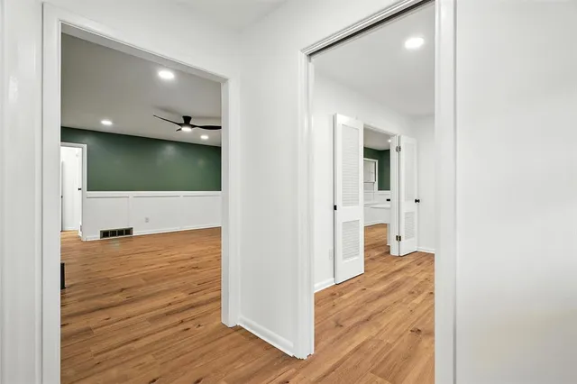 a view of a living room with wooden floor