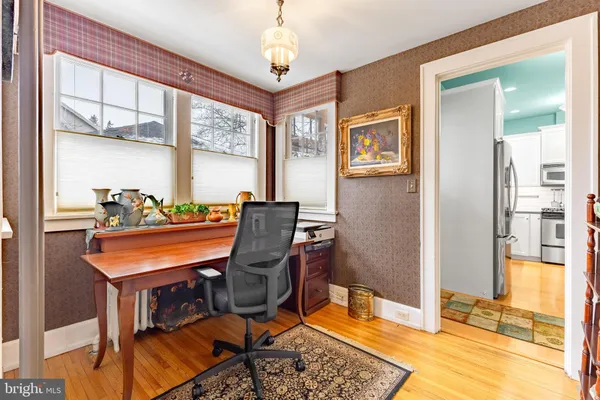 a living room with furniture and stairs