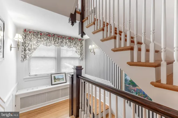 a bathroom with a sink mirror and a shower