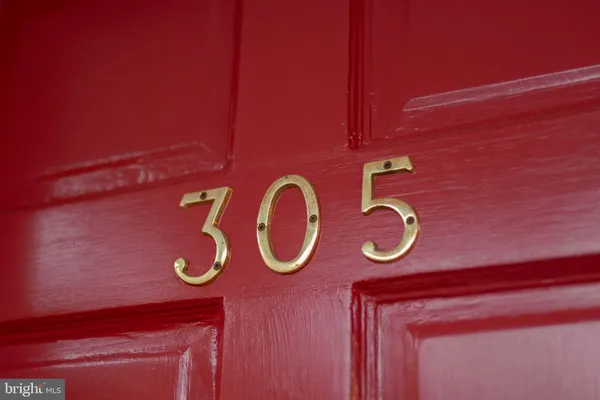 a view of entryway with wooden floor and stairs