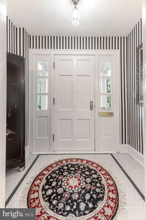 a living room with furniture fireplace and a table