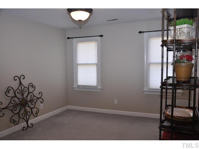 8904 Windjammer Drive Raleigh, NC 27615 - Photo 18 of 25 vacant bedroom with walk-in closet currently used for storage--just waiting for the new owner to personalized and enjoy Bedroom