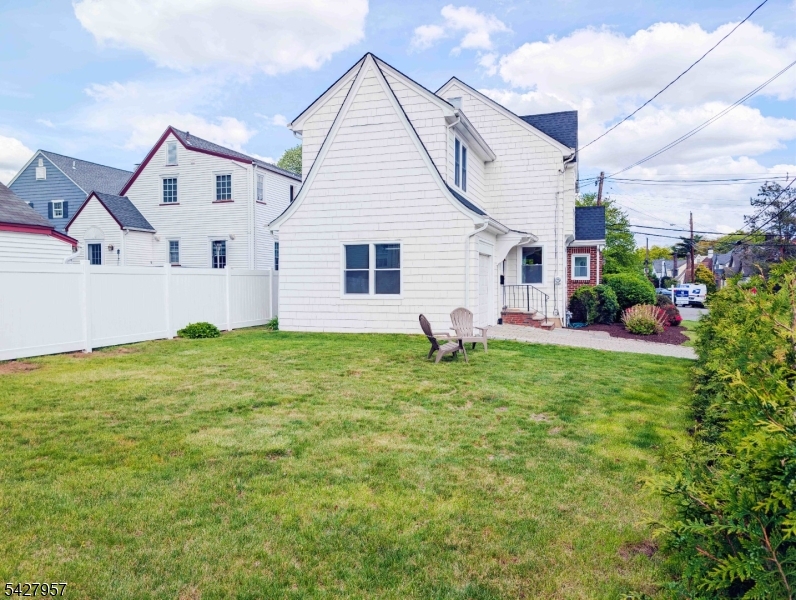 909 Ridgewood Road Millburn, NJ 07041 - Photo 28 of 33 a view of a house with backyard and garden