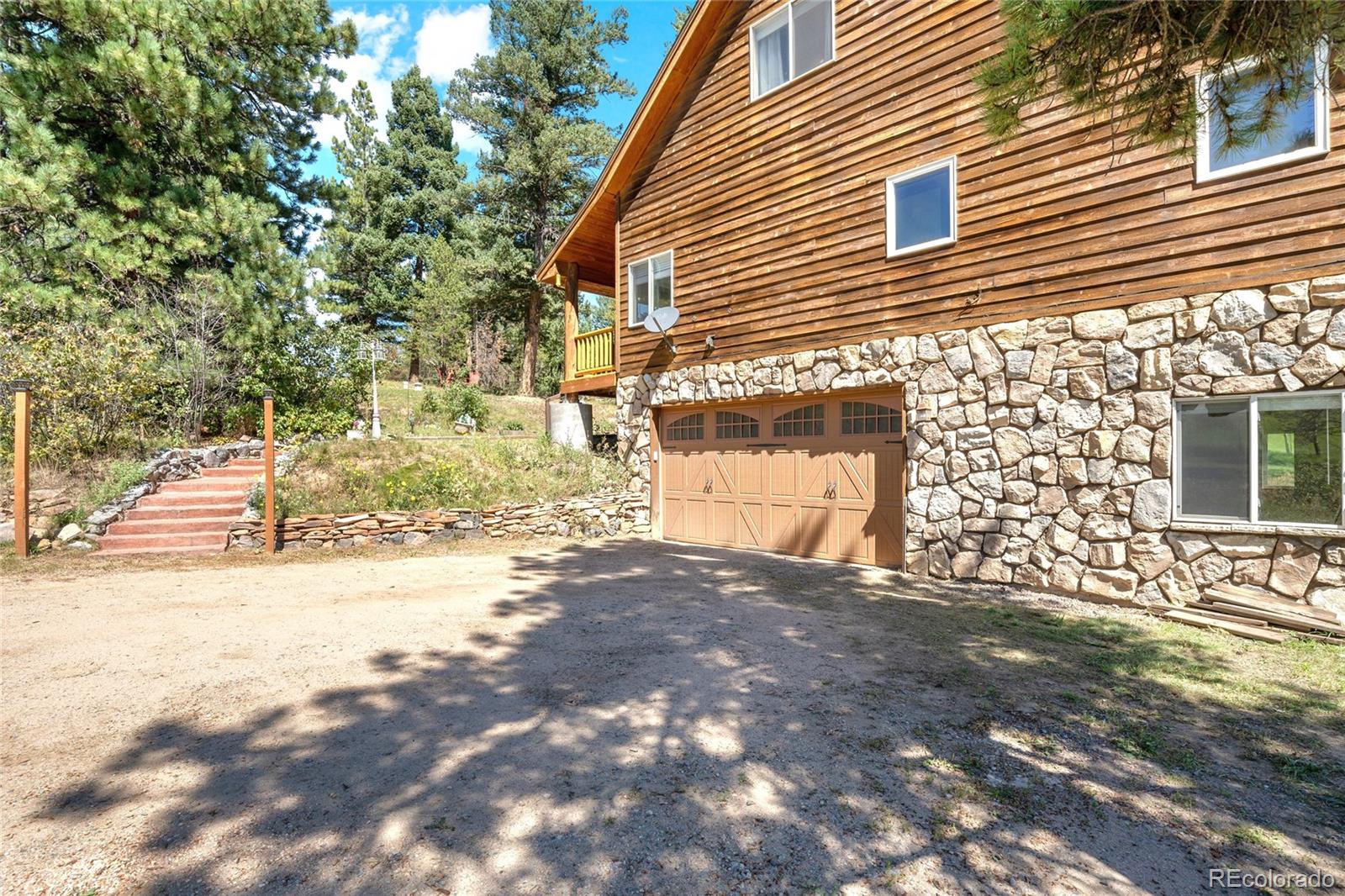 20133 Silver Ranch Road Conifer, CO 80433 - Photo 38 of 40 a view of back yard of the house