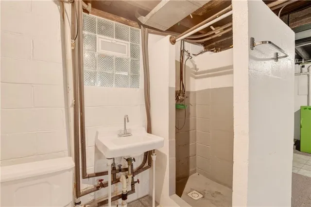 a view of empty room with wooden walls