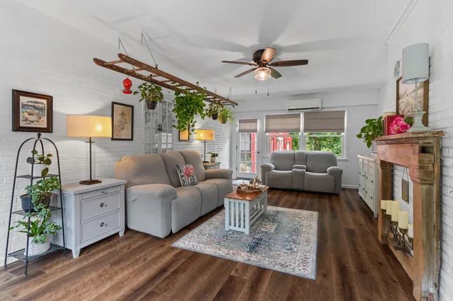 a spacious bathroom with a toilet a sink and a mirror