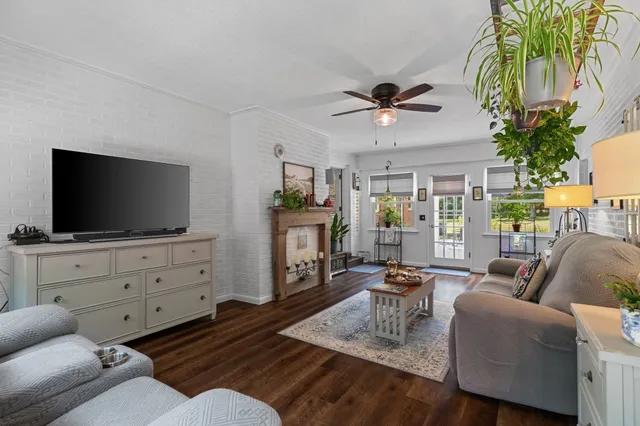 a bedroom with bed chair and a window
