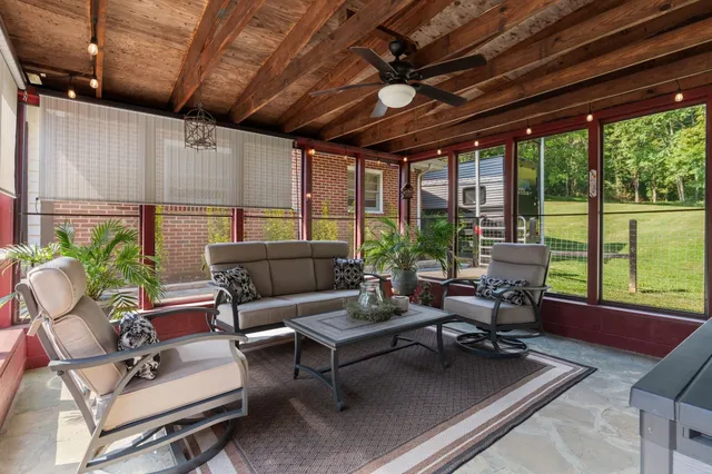 an aerial view of a house with swimming pool