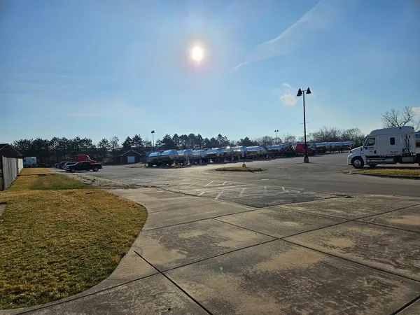 a view of a swimming pool and an outdoor seating