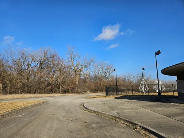 a view of road with a building in the background