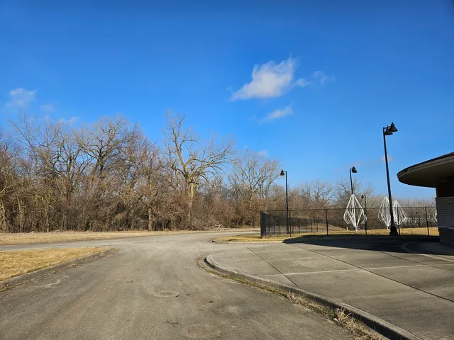 a view of road with a building in the background