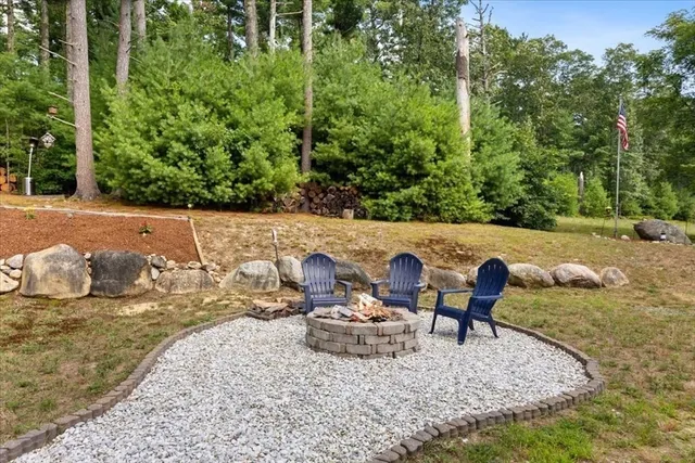 a view of a backyard with sitting area