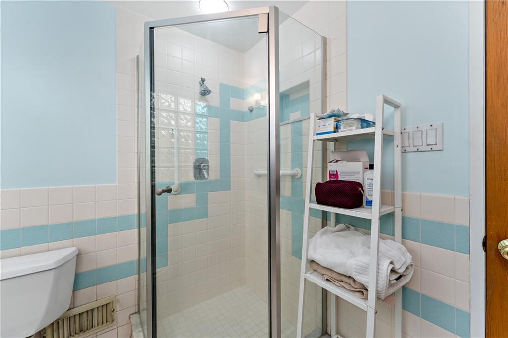 3905 Middleboro Road Pittsburgh, PA 15234 - Photo 14 of 32 a bathroom with a shower and a toilet