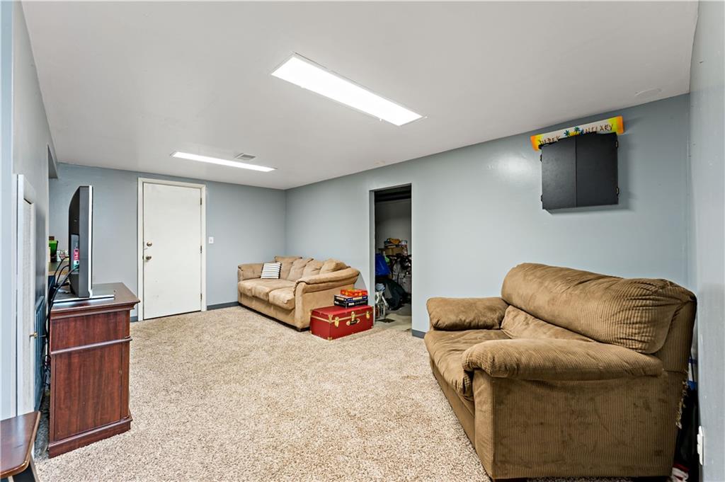 3905 Middleboro Road Pittsburgh, PA 15234 - Photo 20 of 32 a living room with furniture and a flat screen tv