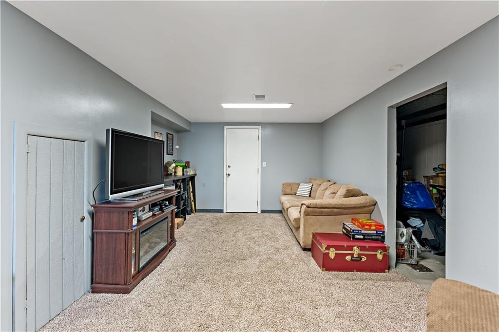 3905 Middleboro Road Pittsburgh, PA 15234 - Photo 21 of 32 a living room with furniture and a flat screen tv