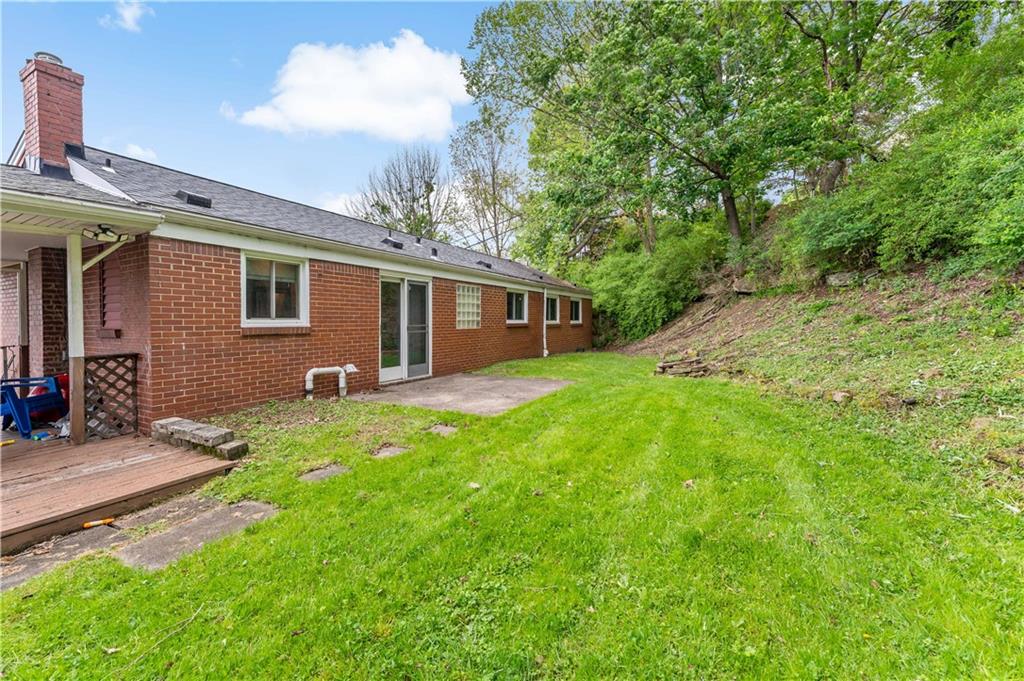 3905 Middleboro Road Pittsburgh, PA 15234 - Photo 26 of 32 a view of a house with backyard and sitting area