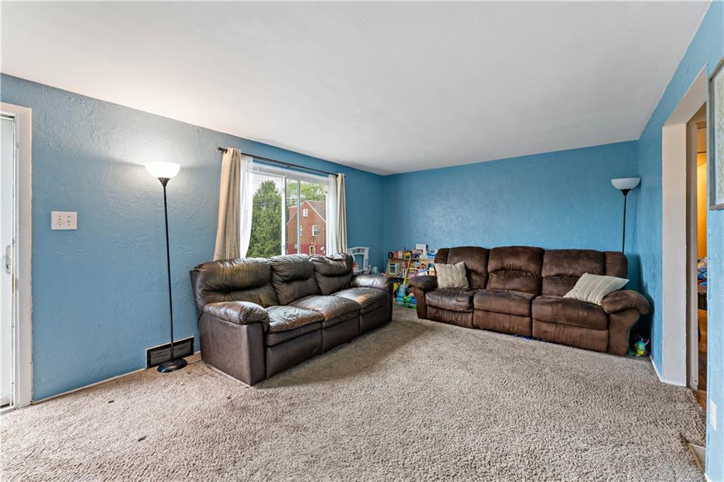 3905 Middleboro Road Pittsburgh, PA 15234 - Photo 4 of 32 a living room with a couch and a window
