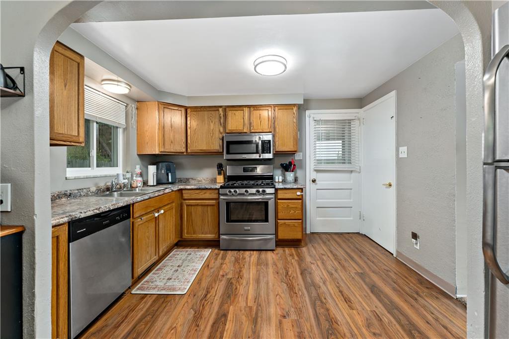 3905 Middleboro Road Pittsburgh, PA 15234 - Photo 8 of 32 a kitchen with stainless steel appliances granite countertop a stove and a sink