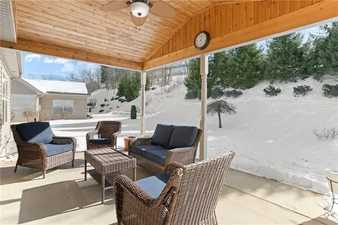 a outdoor space with patio the couches and a dining table with chairs
