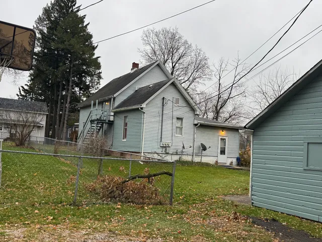 a backyard of a house with garden and patio