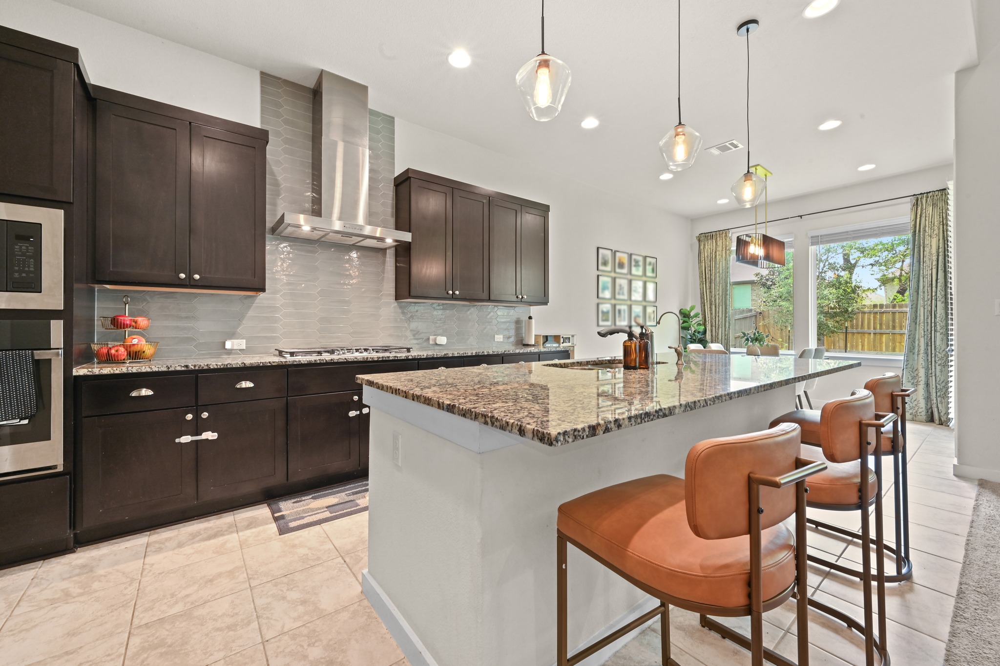 4434 Hannover Way Round Rock, TX 78681 - Photo 14 of 40 a kitchen with granite countertop counter space a sink stainless steel appliances and cabinets