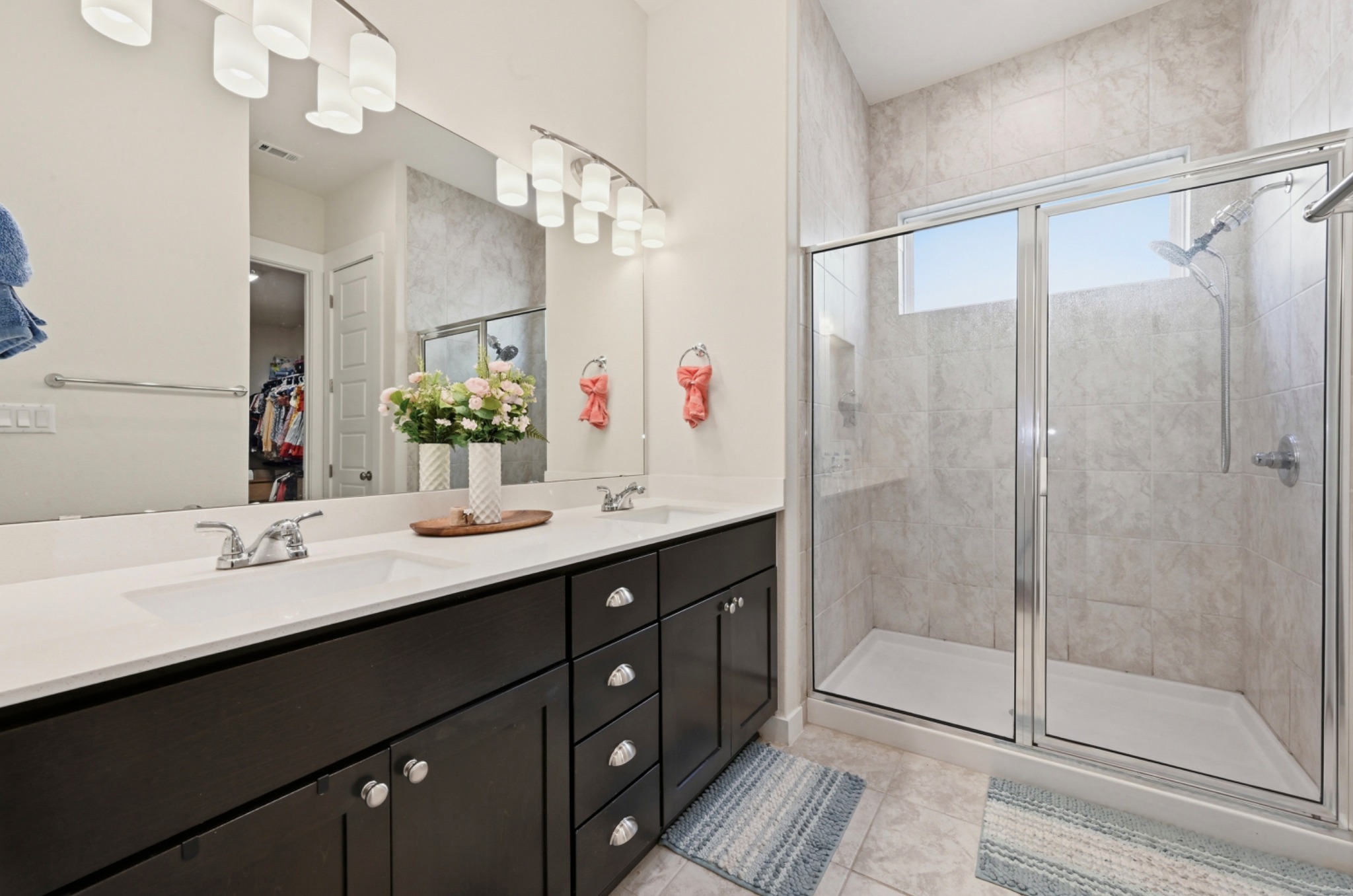 4434 Hannover Way Round Rock, TX 78681 - Photo 18 of 40 a bathroom with a double vanity sink mirror and double