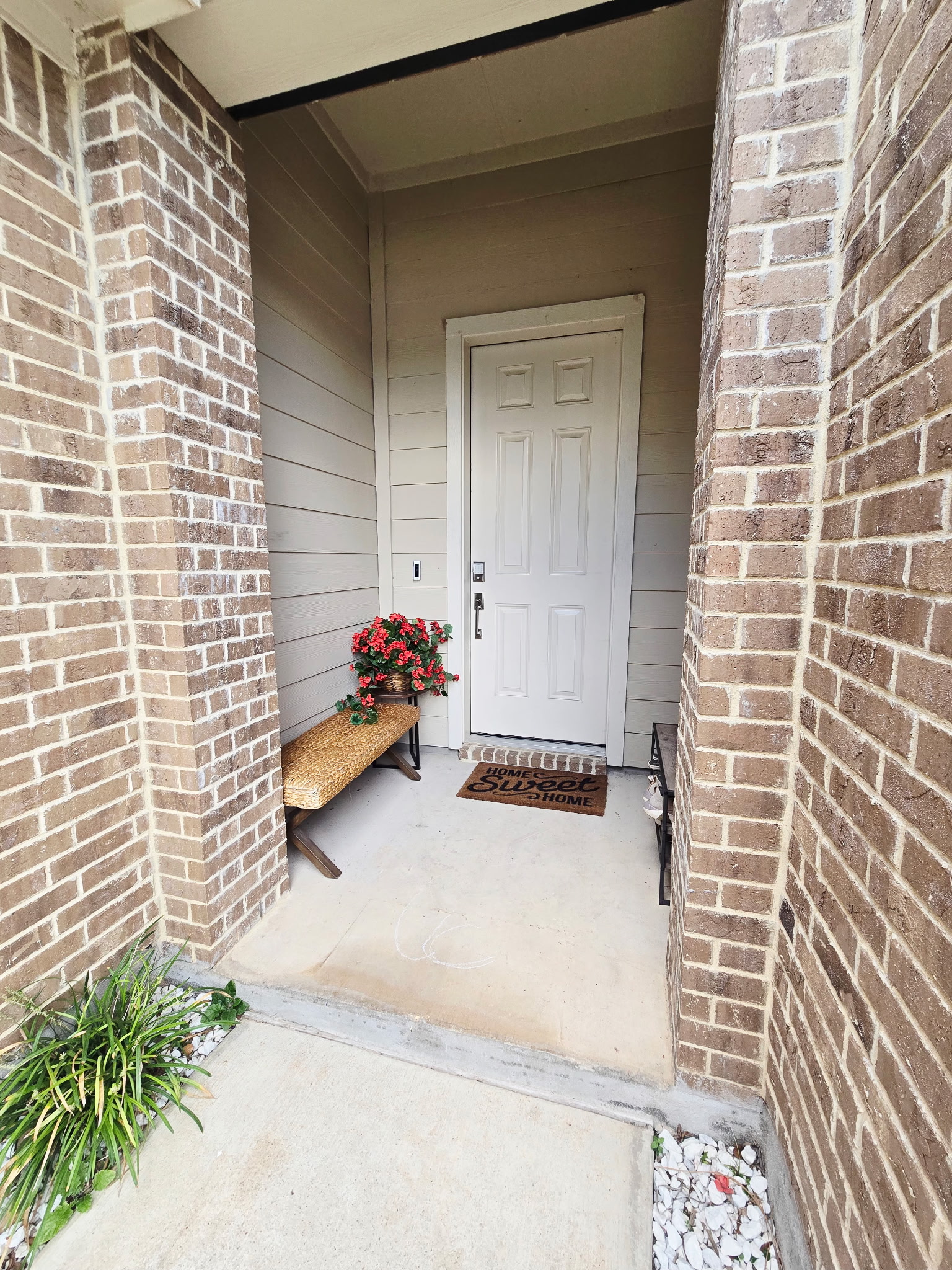 4434 Hannover Way Round Rock, TX 78681 - Photo 20 of 23 View of exterior entry with covered porch and brick siding