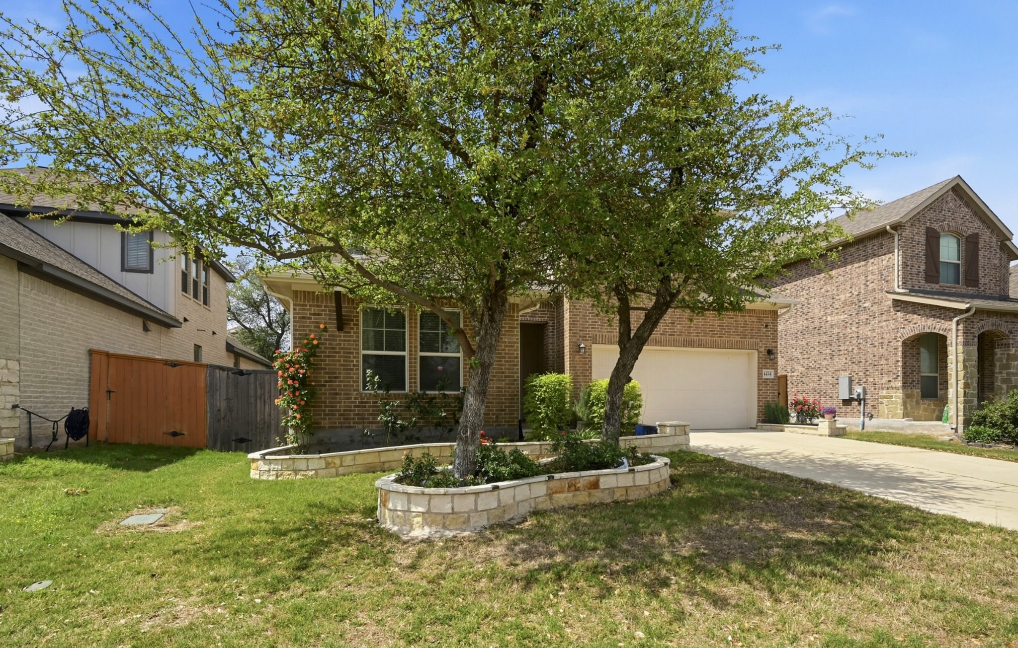 4434 Hannover Way Round Rock, TX 78681 - Photo 3 of 40 a front view of a house with a yard and a garage