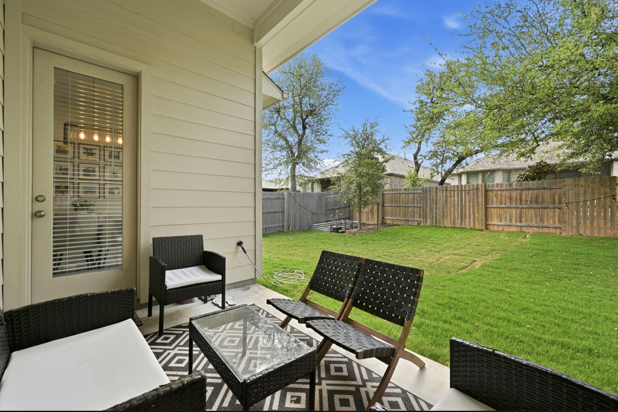 4434 Hannover Way Round Rock, TX 78681 - Photo 31 of 40 a view of a chairs and table in patio with a yard