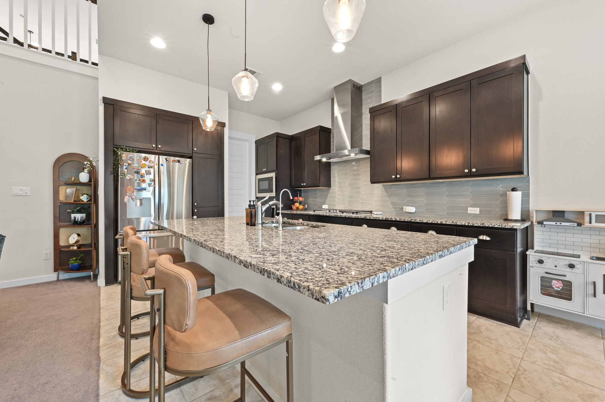 4434 Hannover Way Round Rock, TX 78681 - Photo 10 of 40 a kitchen with stainless steel appliances granite countertop a sink and a stove