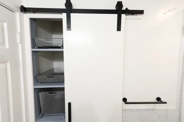 a bathroom with a sink and shower