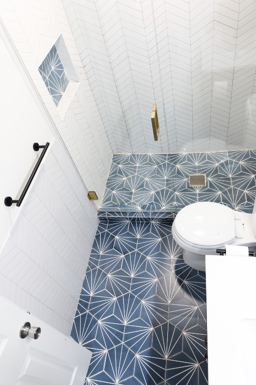 1304 Summit Street, Unit 209 Austin, TX 78741 - Photo 15 of 27 a bathroom with a sink and a mirror