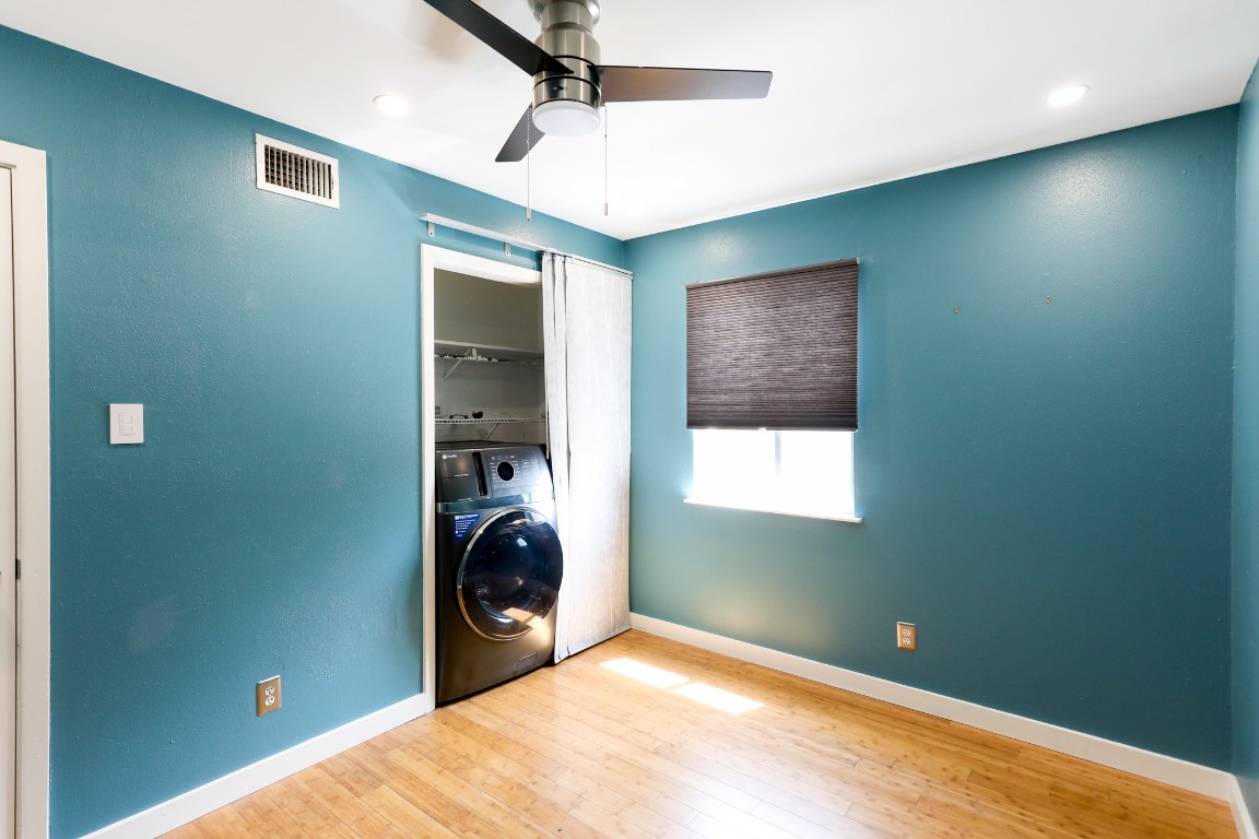 1304 Summit Street, Unit 209 Austin, TX 78741 - Photo 16 of 27 a view of a livingroom with washer and dryer