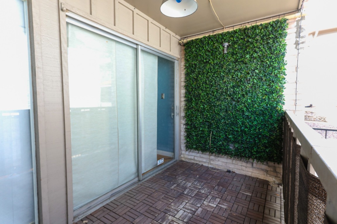 1304 Summit Street, Unit 209 Austin, TX 78741 - Photo 21 of 27 a view of a back yard from a corridor