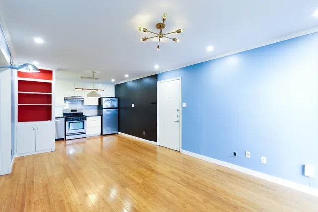 a view of an empty room with a window