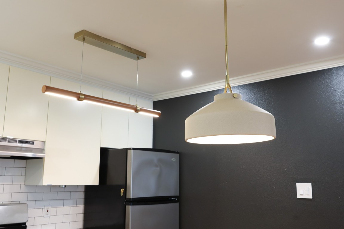 1304 Summit Street, Unit 209 Austin, TX 78741 - Photo 8 of 27 a lamp on a kitchen counter top space