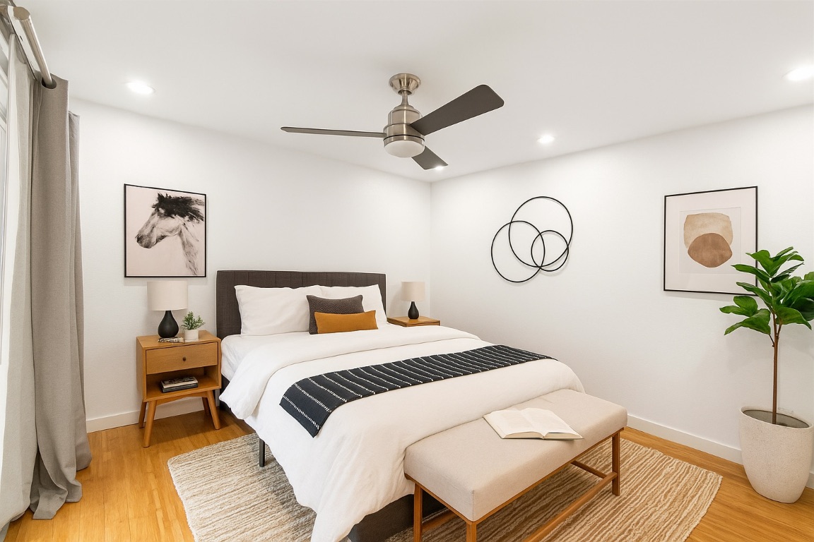 1304 Summit Street, Unit 209 Austin, TX 78741 - Photo 9 of 27 a bedroom with a bed and a table