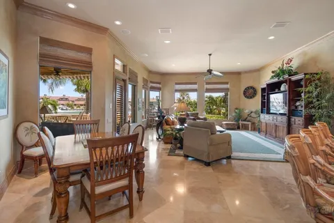 an aerial view of a house with outdoor space and lake view