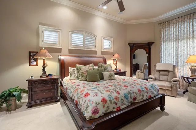 a bedroom with furniture and a window